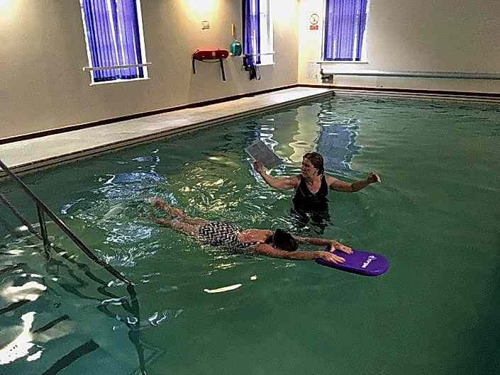 Bernadette performing Front Crawl leg kick....previously Bernadette was unable to put her face into the water and exhale